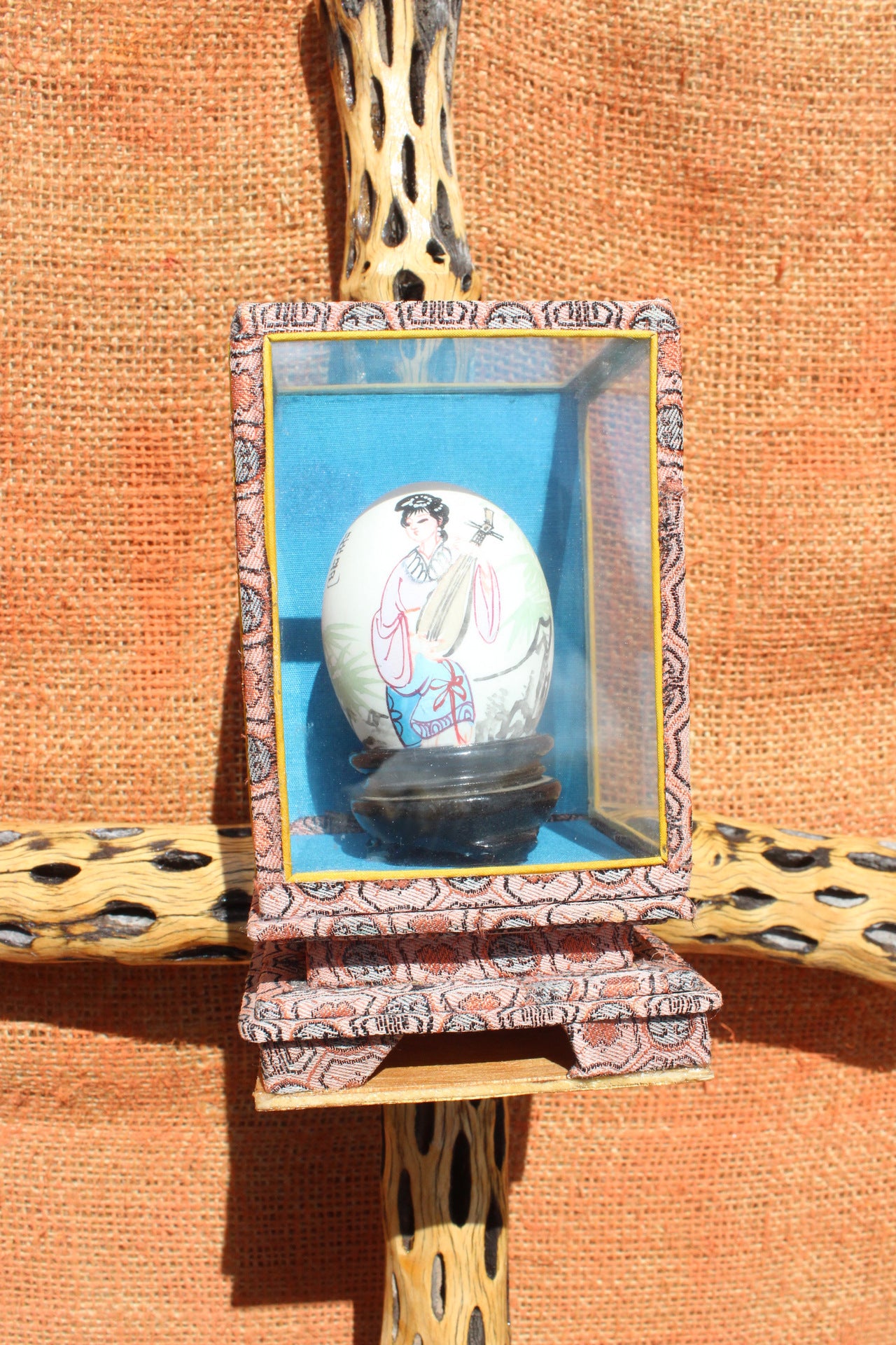 Lady On The Egg In a Box On a Cross